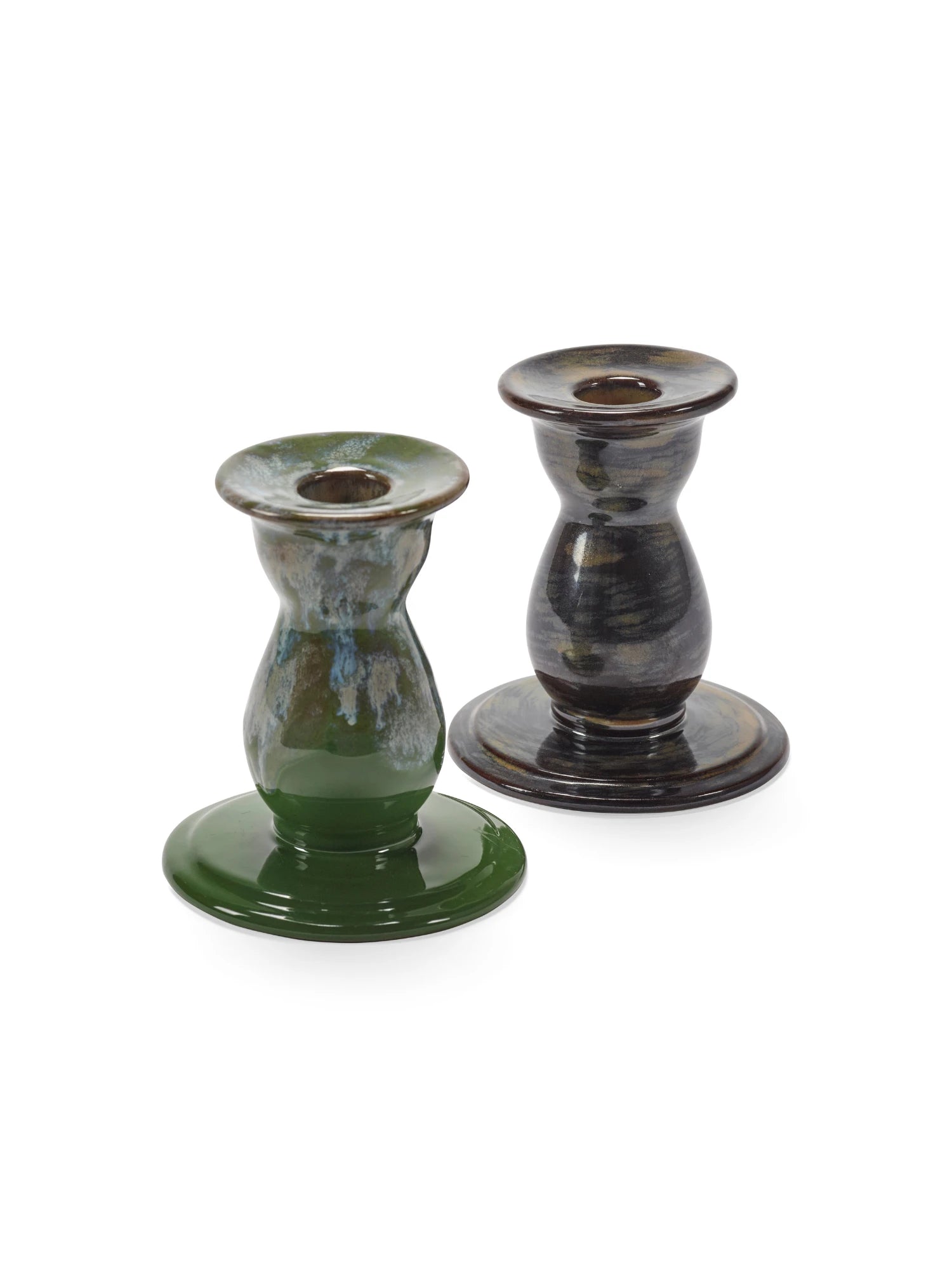 Two ceramic candle holders on a white background