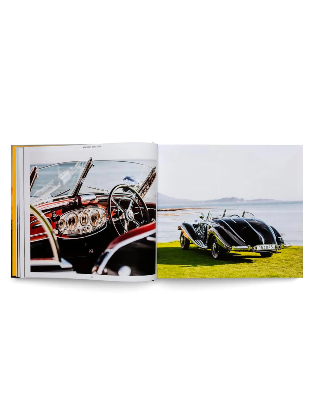 Book The Germans – Beautiful machines, an open hardcover book displaying vibrant images of classic Mercedes-Benz cars. The left page shows a detailed close-up of a luxurious red interior and dashboard, while the right page features a sleek black vintage convertible parked on green grass by the ocean. This exquisite automotive history book is perfect for classic car enthusiasts and collectors.