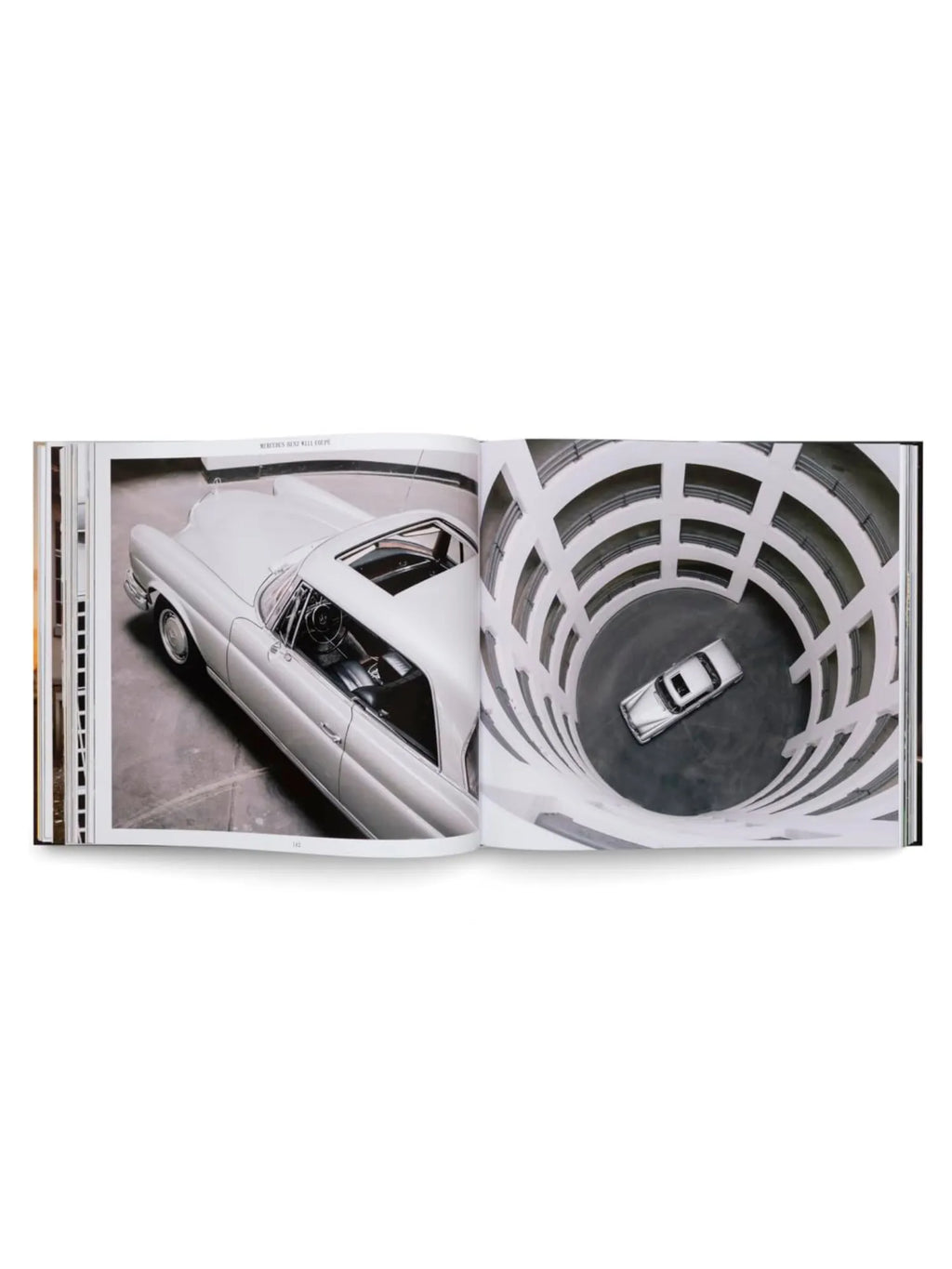 Book The Germans – Beautiful machines, an open hardcover book showcasing an elegant, light gray vintage Mercedes-Benz W111 Coupe on the left page and a top-down view of a similar car in a multi-story spiral parking garage on the right. This premium automotive photography book is perfect for car enthusiasts and collectors of stunning visual art books.