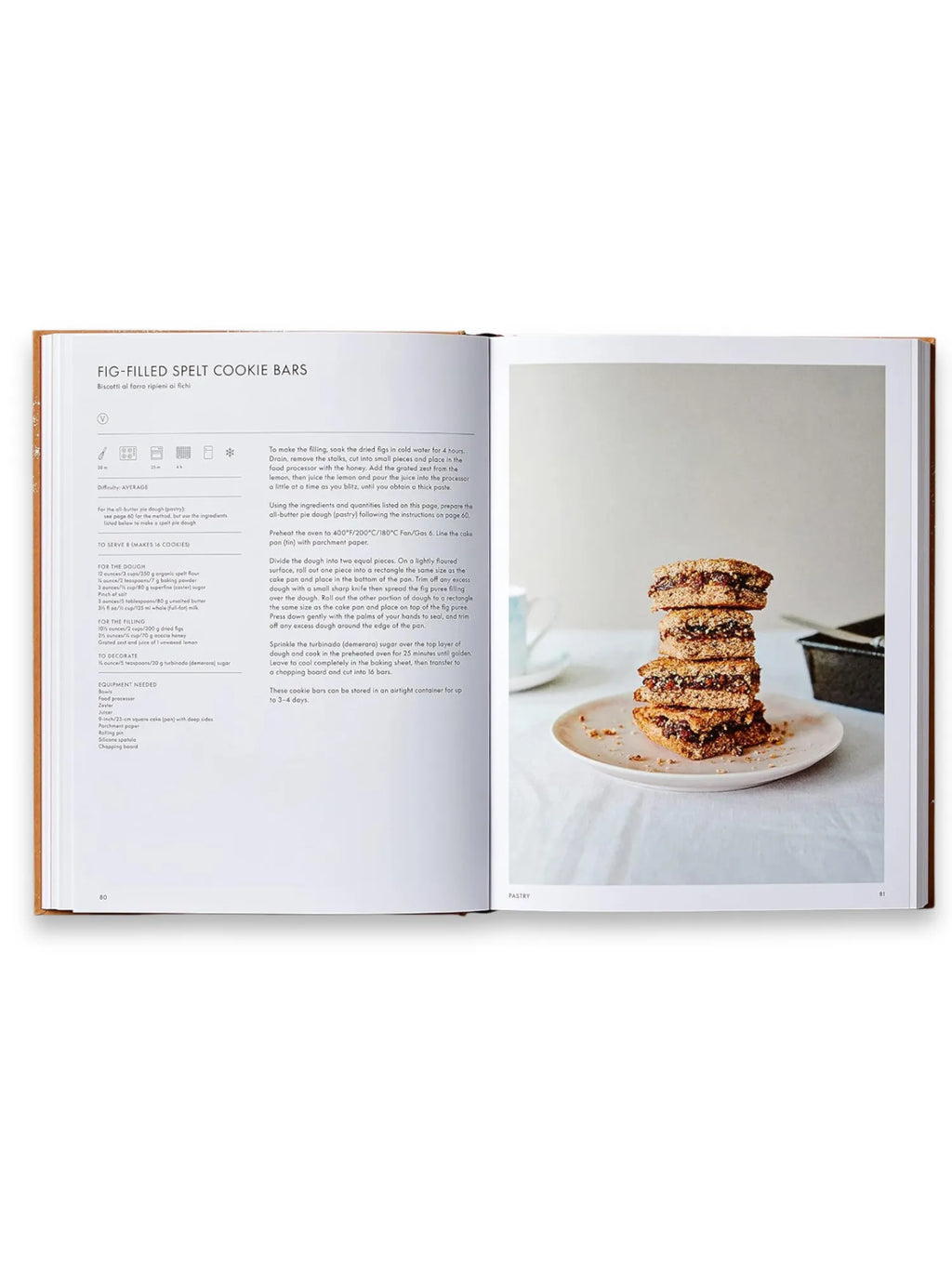 Book The Italian Bakery, an open cookbook displaying a recipe for "Fig-Filled Spelt Cookie Bars" on the left page and a beautiful, styled photograph of a stack of five homemade cookie bars with a rich fig filling on a light pink plate on the right. This premium cookbook is perfect for home bakers and culinary enthusiasts interested in authentic Italian baking.
