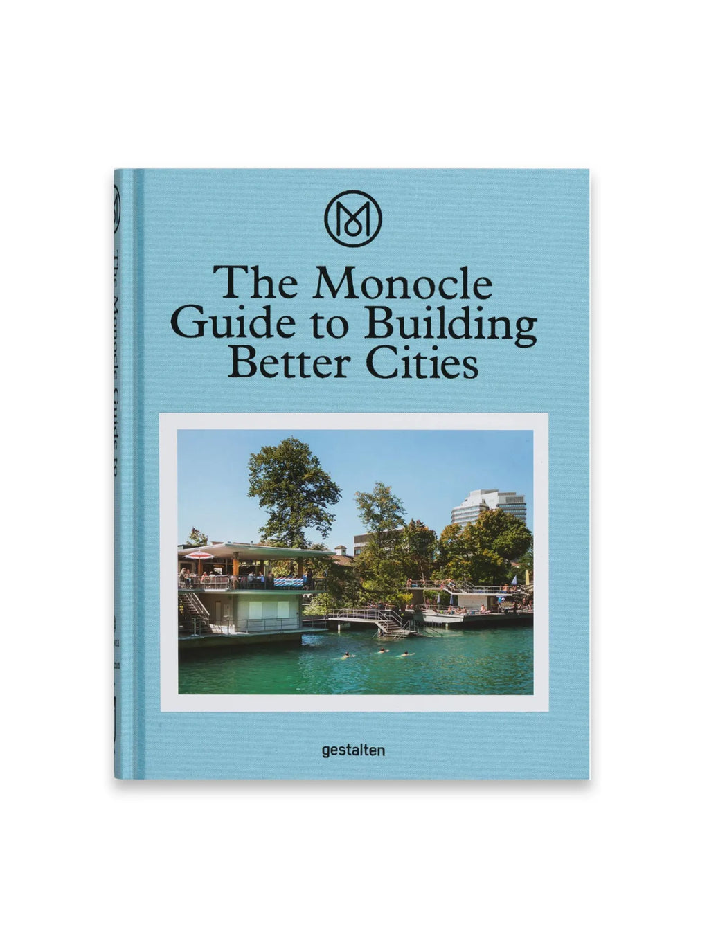 Book The Monocle Guide to Building Better Cities, a stylish hardcover book with a textured light blue cover featuring a central image of a vibrant waterfront scene with buildings, trees, and people. This essential urban planning guide is perfect for architects, city planners, and anyone interested in sustainable urban development.