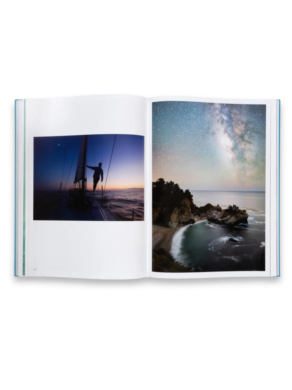 Book The Oceans, an open hardcover photography book with a light blue spine, displaying two stunning ocean-themed images. The left page shows a person on a sailboat at dusk with a vibrant horizon, while the right page features a breathtaking night sky with the Milky Way over a rugged coastline and beach. This premium coffee table book is perfect for photography enthusiasts and nature lovers.