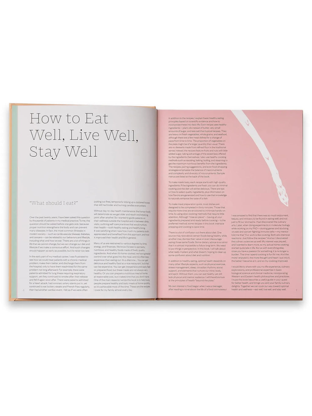 Book The Wellness Principles: Cooking for a Healthy Life, an open, premium hardcover cookbook with a light beige spine and white pages revealing text about healthy eating and cooking principles. This essential healthy living guide offers delicious recipes and wellness strategies for home cooks.