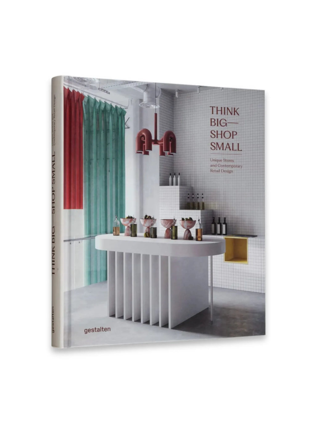 Book Think Big Shop Small, a premium hardcover book featuring a modern retail interior design on the cover, with red and teal curtains, a white tiled wall, and a unique counter. This inspiring book is perfect for retail entrepreneurs, designers, and business owners seeking innovative contemporary retail design ideas.