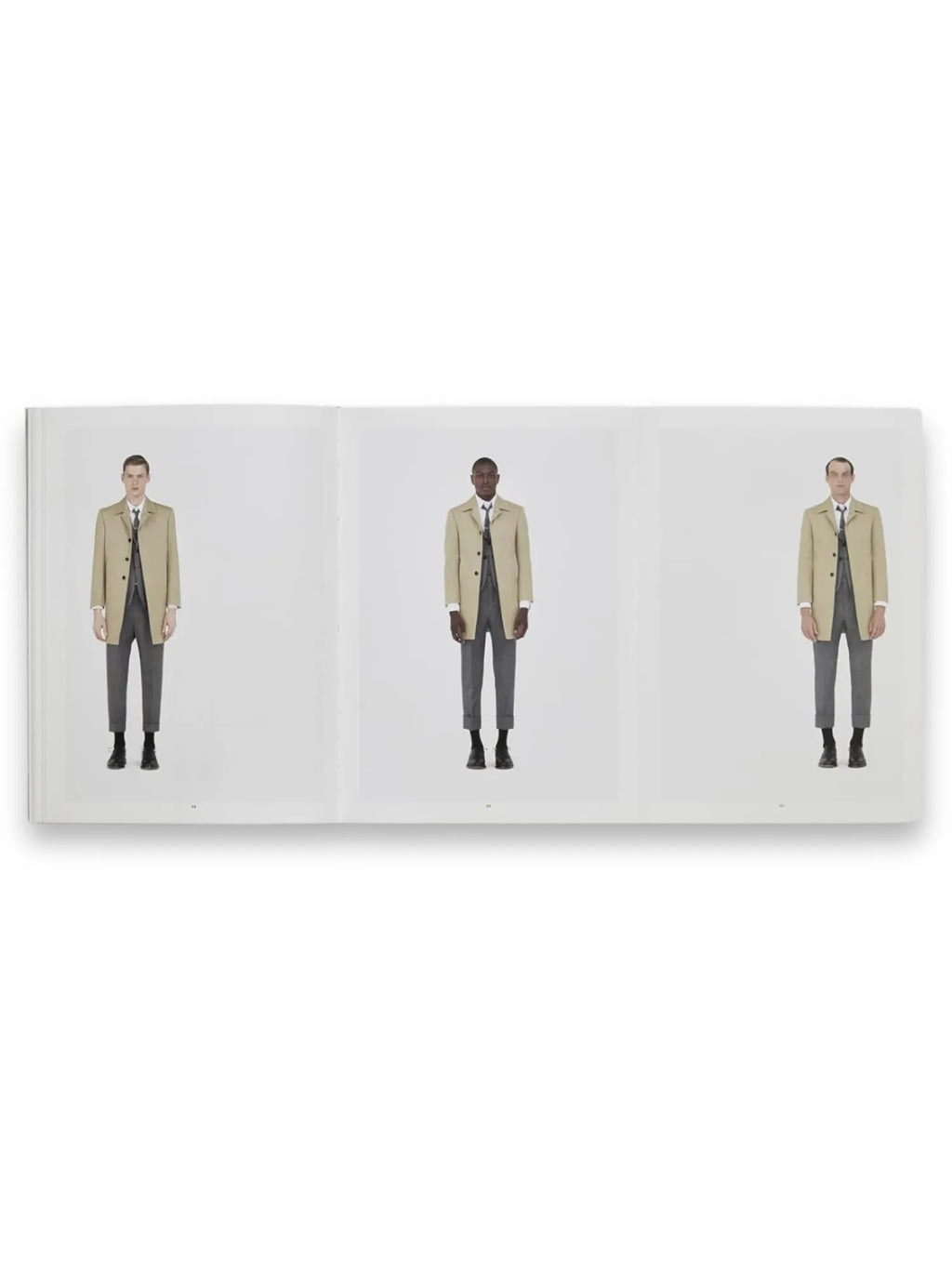Book Thom Browne, an open fashion book displaying three male models in identical stylish beige trench coats over gray suits and black shoes, against a clean white background. This luxury fashion book is perfect for designers, fashion enthusiasts, and collectors seeking inspiration and insight into Thom Browne's iconic menswear.