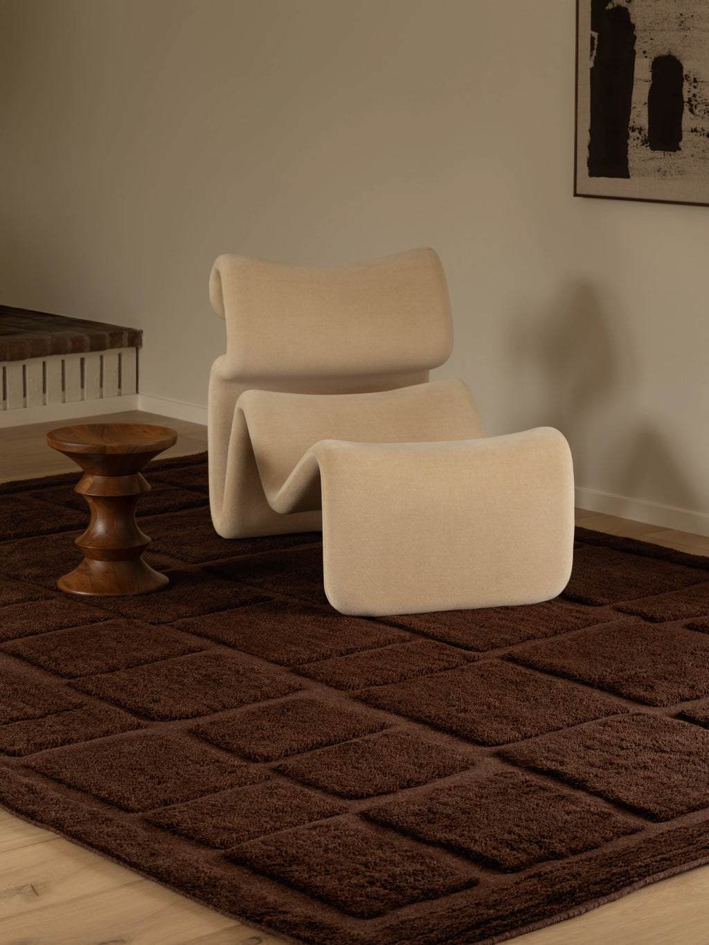 Tinted Objects Wandel Wool Rug, a luxurious dark brown shag rug featuring a plush, raised square pattern. This elegant area rug adds warmth and texture to any modern living space or bedroom.