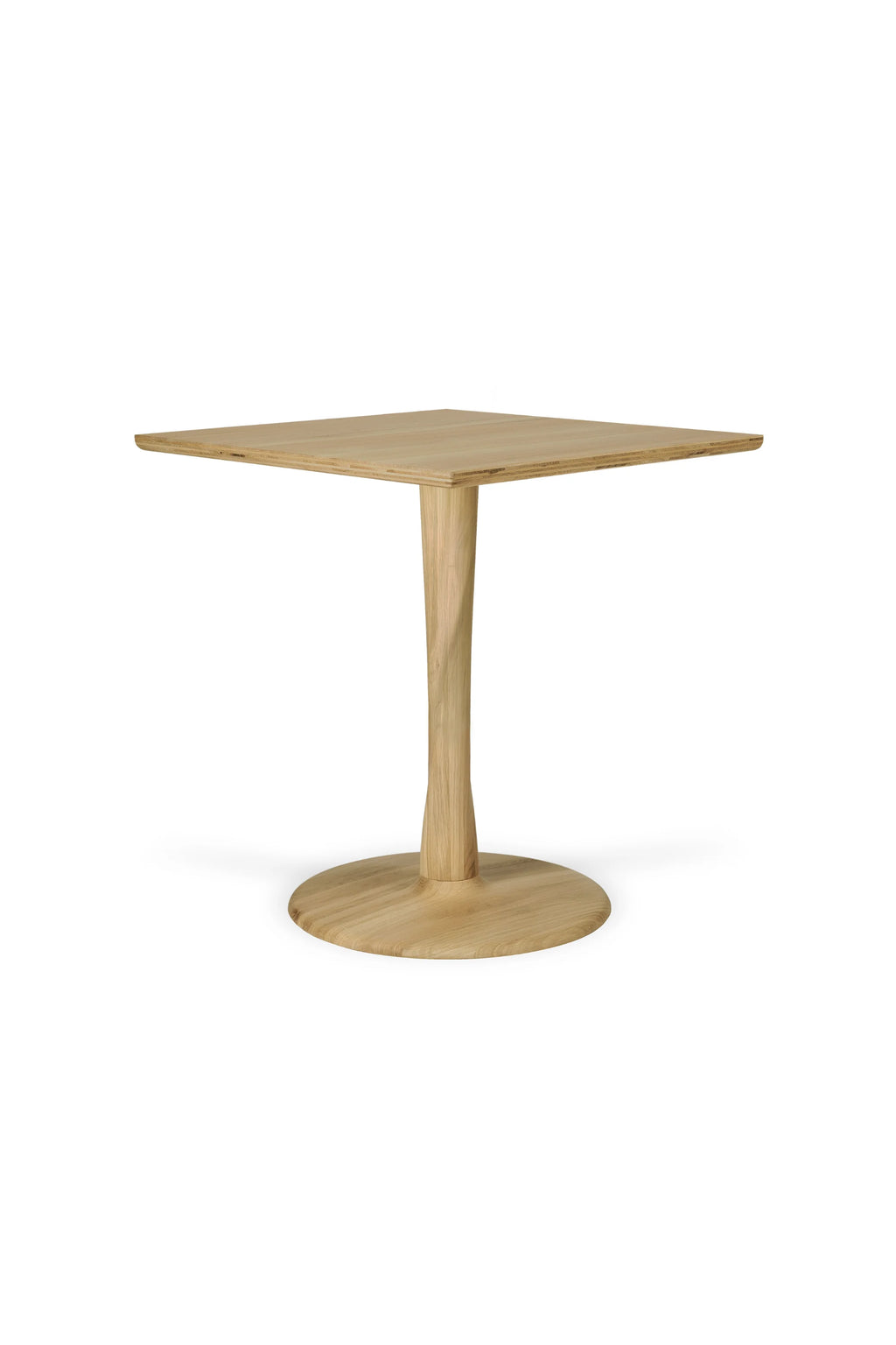 Ethnicraft Torsion Dining Table, a contemporary square dining table crafted from light oak wood with a smooth finish and subtle visible plywood layers on the tabletop edge.