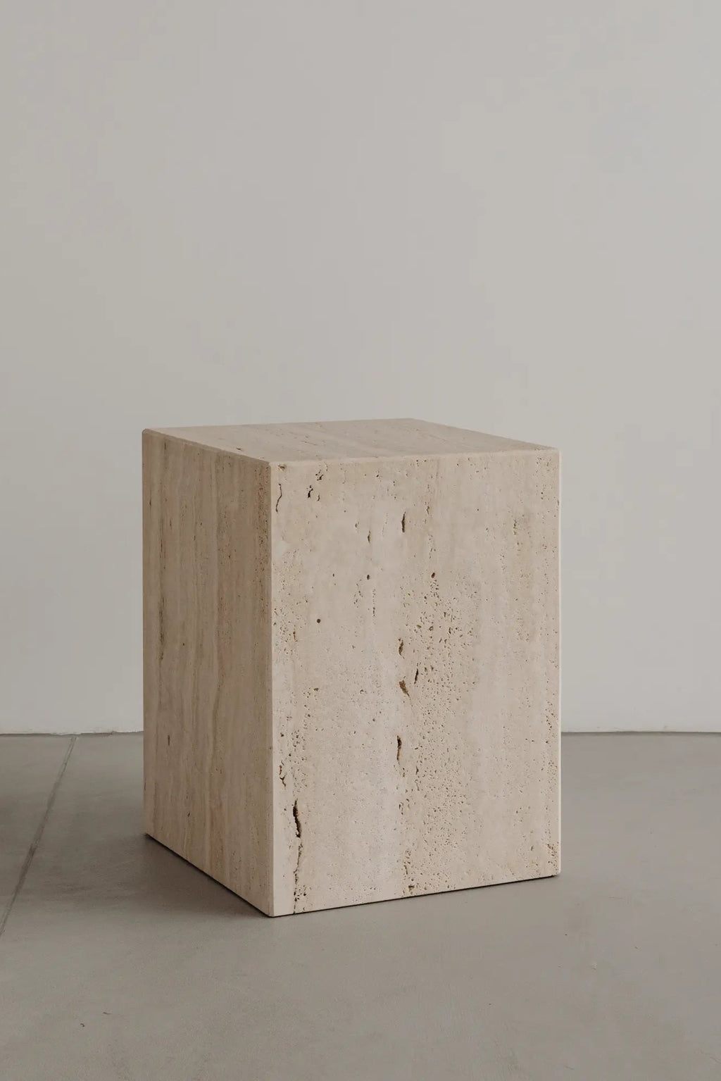 Close-up of Coi Travertine Pillar showcasing its natural textures and patterns