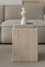 Coi Travertine Pillar standing tall in a modern interior design
