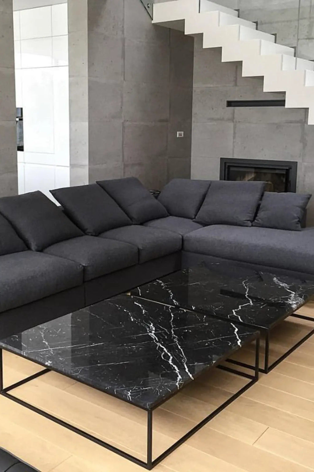 Dione Marble Coffee Table in a living room setting with modern furniture and decor