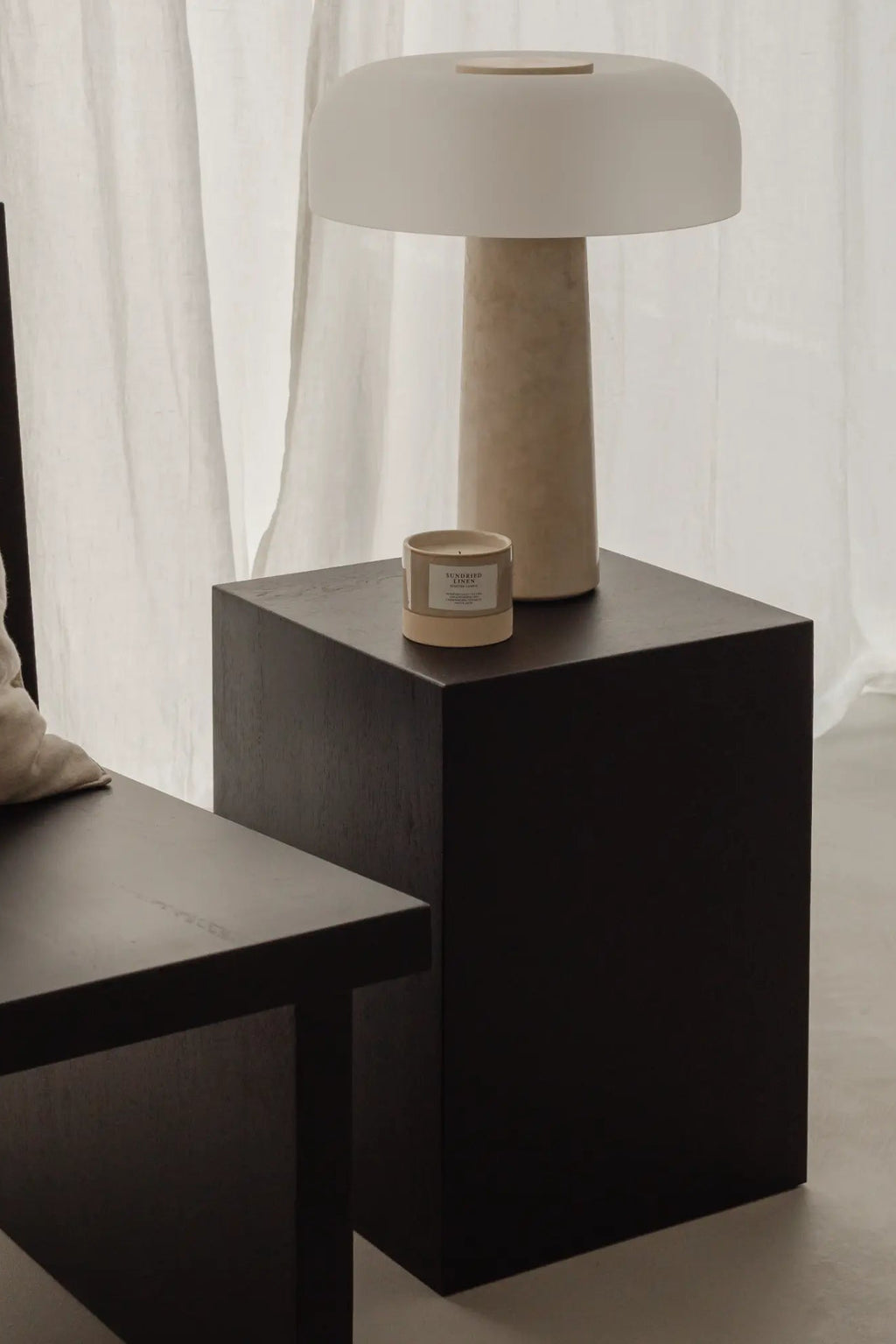 Coi Wood Pillar in dark walnut finish, showcasing elegant and modern design