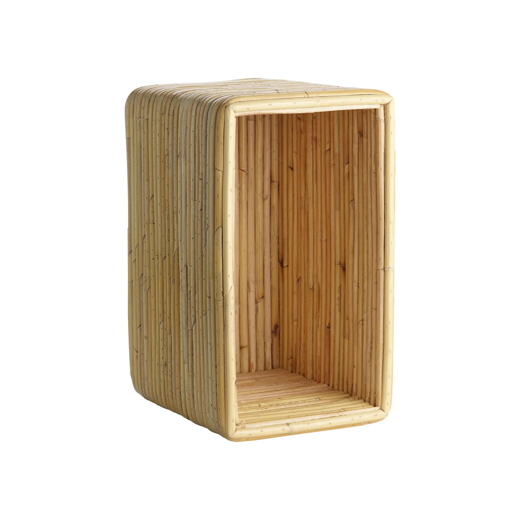 Tine K Viva Rattan Shelf, a rectangular open storage shelf crafted from natural rattan poles in a warm honey-toned finish, featuring a distinctive vertical ribbed texture and smoothly rounded corners. This versatile boho rattan wall shelf is ideal for adding organic modern style to living rooms, bedrooms, or entryways.