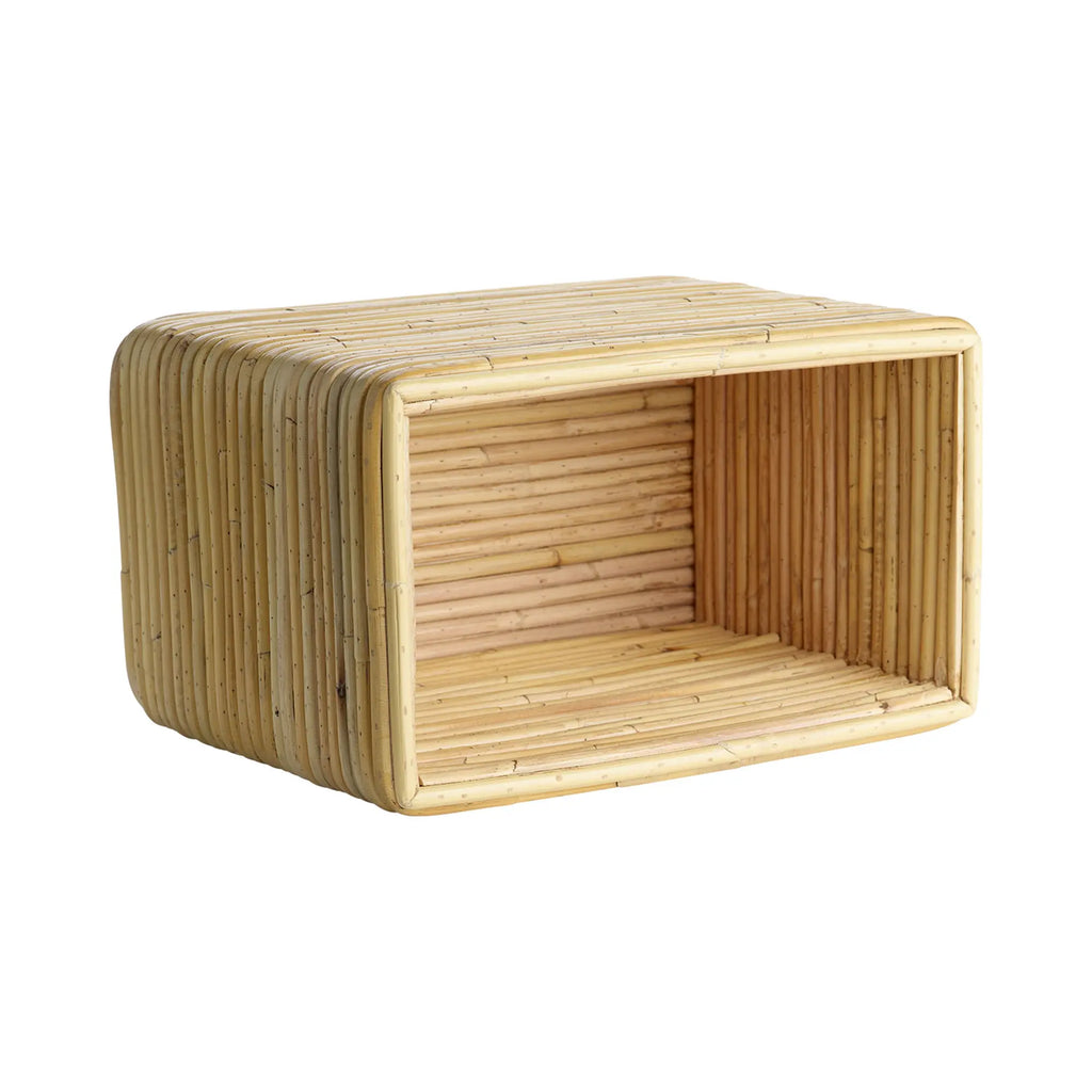 Tine K Viva Rattan Shelf, a rectangular natural rattan wall shelf featuring a unique construction of individual rattan poles creating a textured, ribbed surface and softly rounded corners. This open storage unit offers an organic modern design, perfect for boho living rooms, Scandinavian bedrooms, or coastal-inspired interiors.