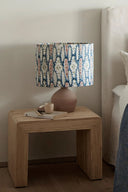 Hand-woven rattan side table with intricate geometric design and sturdy construction