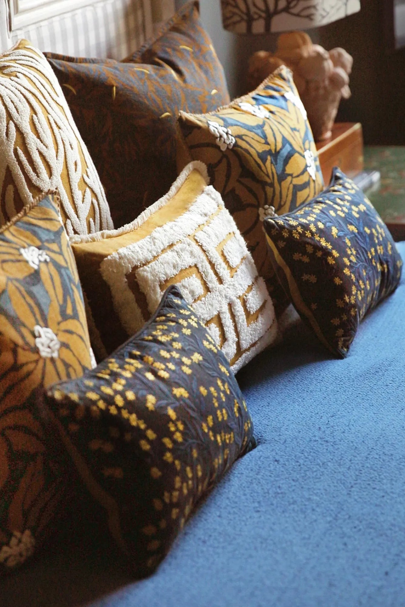 Cleo Cushion with a playful pom pom trim in a fun and colorful print
