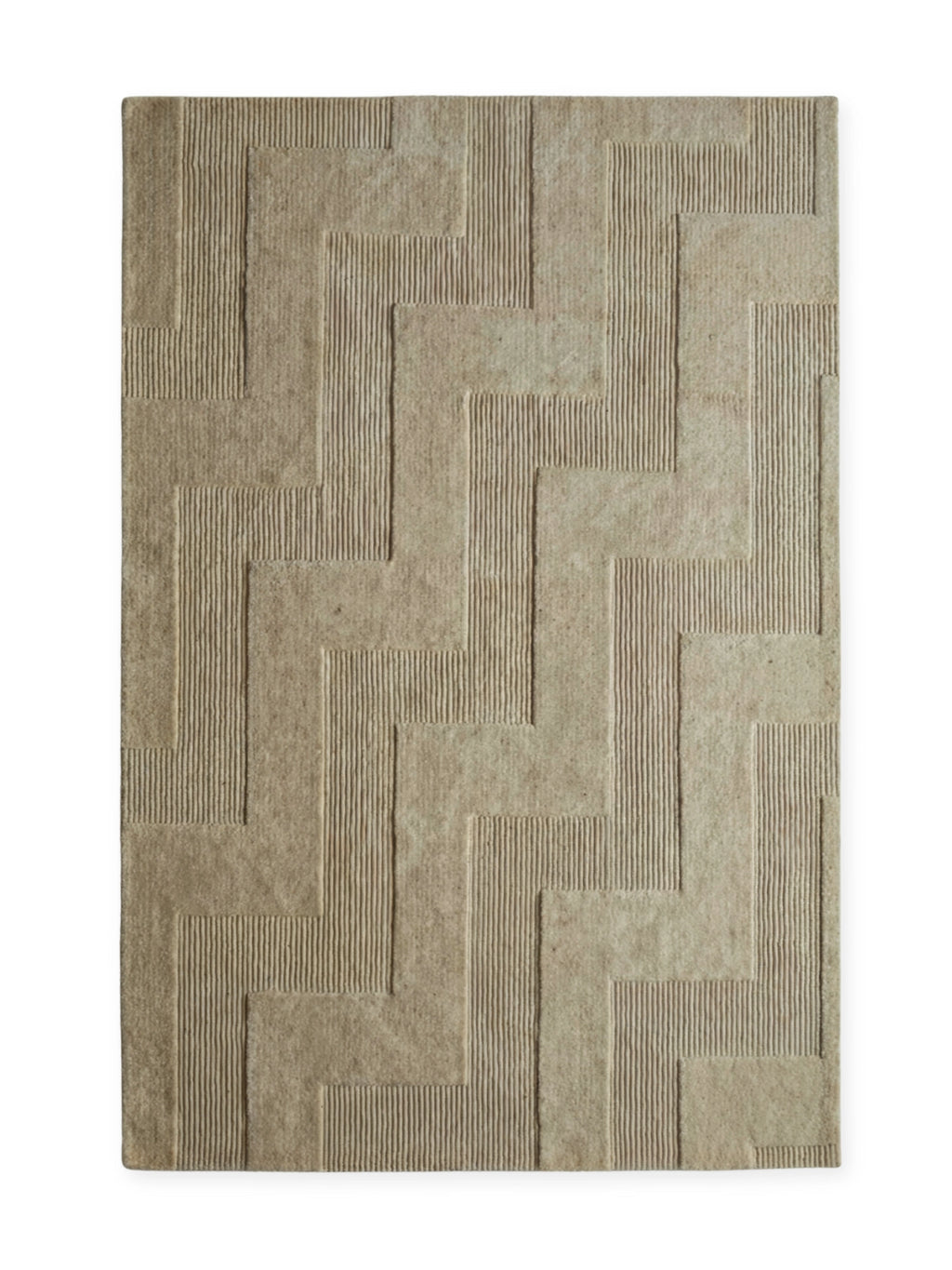 Tinted Objects Valmont Wool Rug, a premium rectangular area rug in a neutral beige or light tan color, featuring a raised geometric pattern of alternating smooth and ribbed textures. This elegant and durable modern rug is ideal for adding sophisticated warmth to contemporary living rooms or bedrooms.