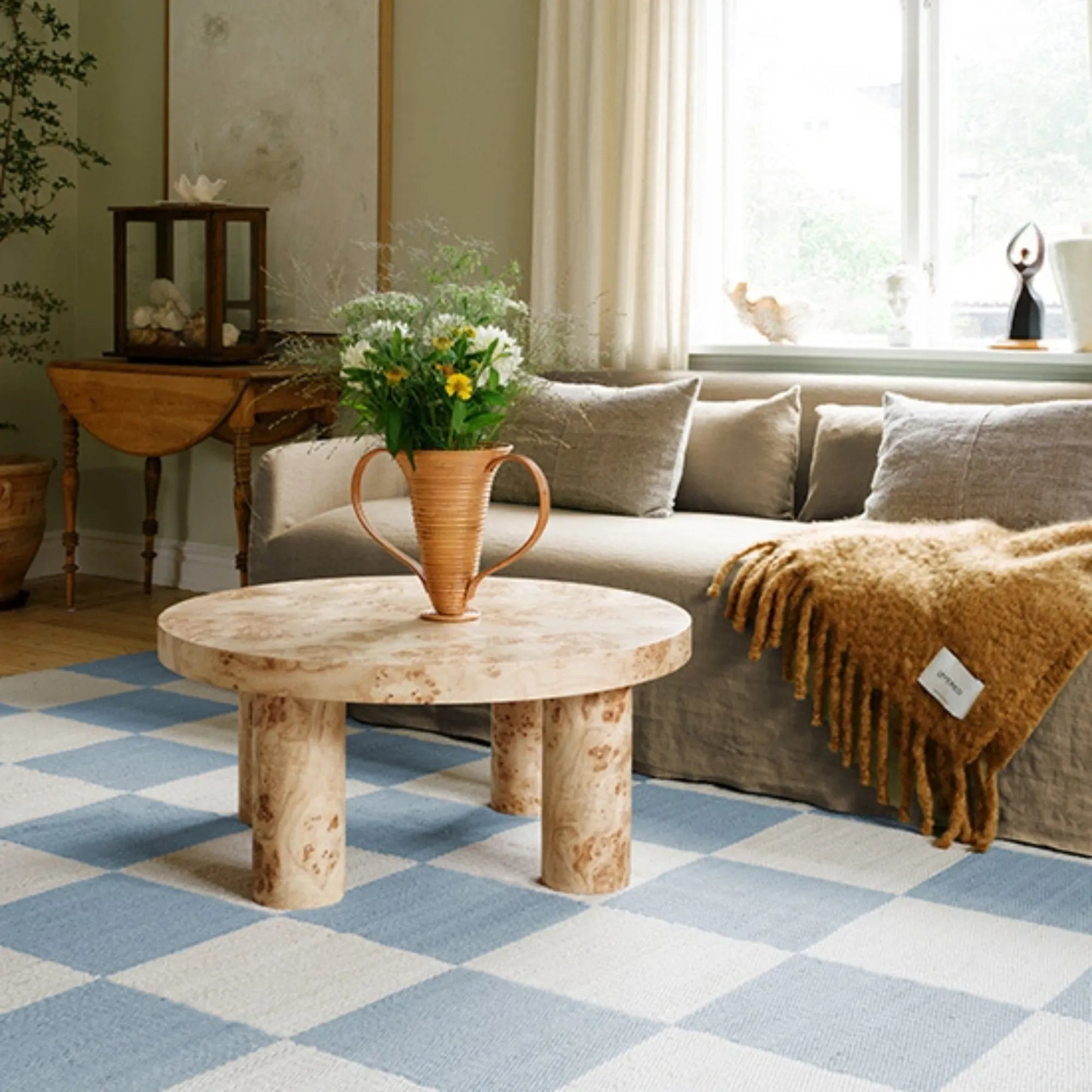 Soft and luxurious wool rug featuring a classic chessboard motif in grey and cream