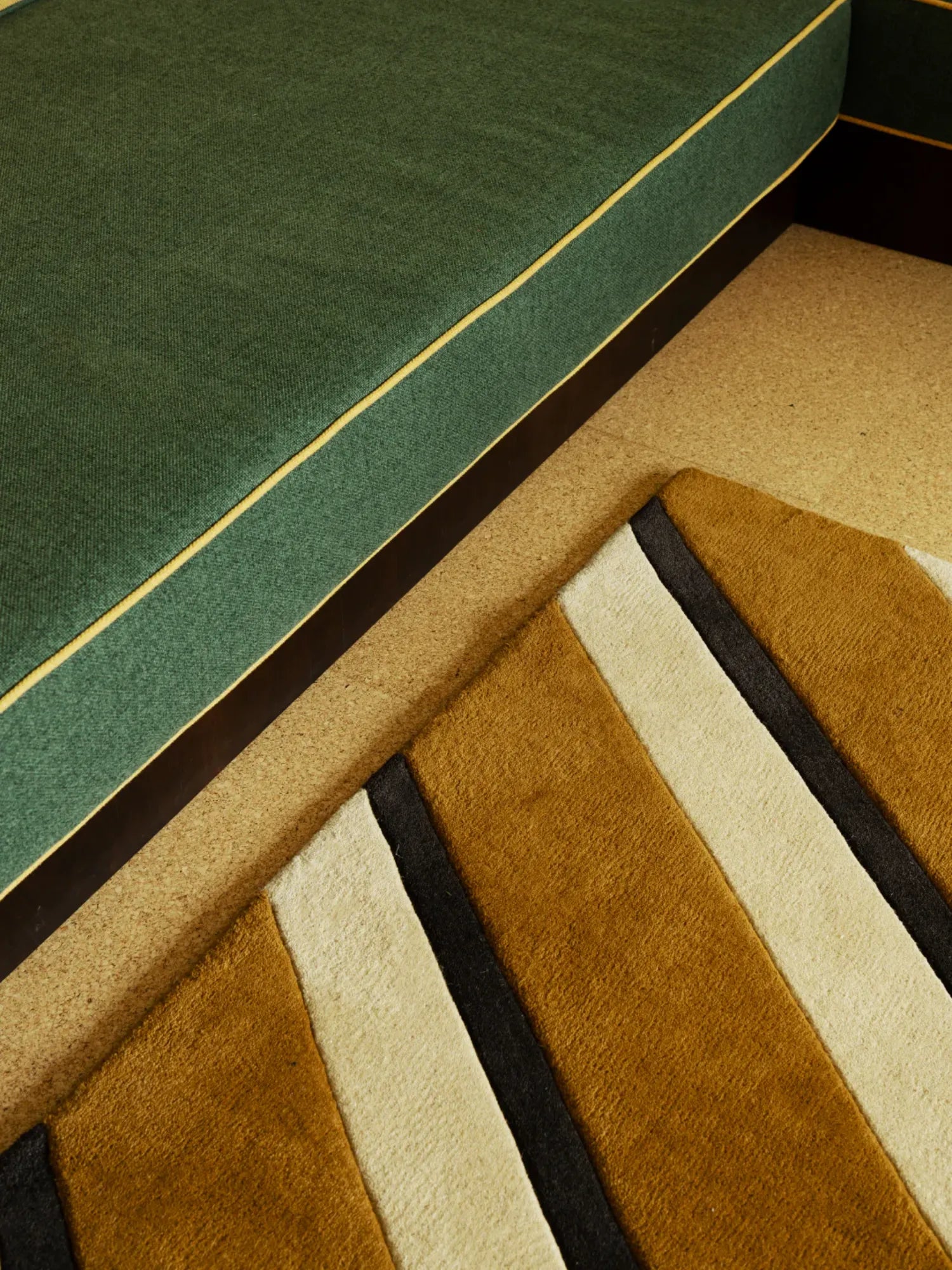 Layered Diagonal Wool Rug, a luxurious modern rug featuring bold diagonal stripes in rich brown, cream, and dark grey. This stylish wool accent rug adds warmth and contemporary design to any living...