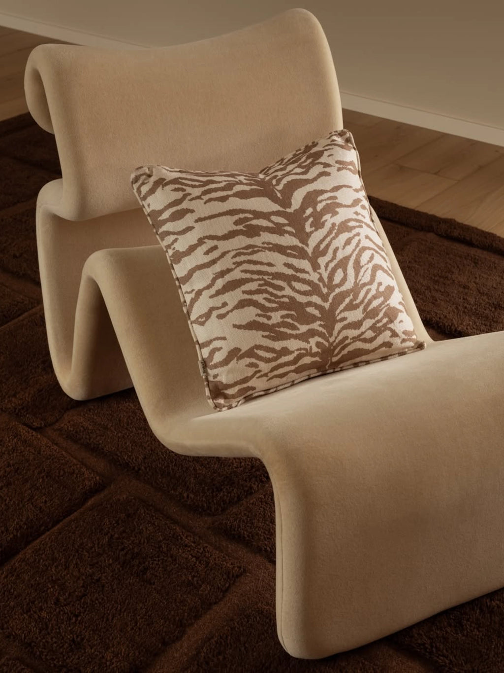 Tinted Objects Norell Throw Pillow, a stylish decorative cushion featuring a striking brown and beige tiger stripe pattern on a textured fabric. This elegant accent cushion adds a touch of modern sophistication to any living space, perfect for contemporary interior design enthusiasts seeking unique home decor.
