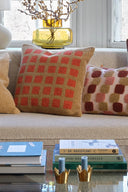 Soft and cozy Mohan Boucle Cushion with a beautiful sand and apricot orange color palette