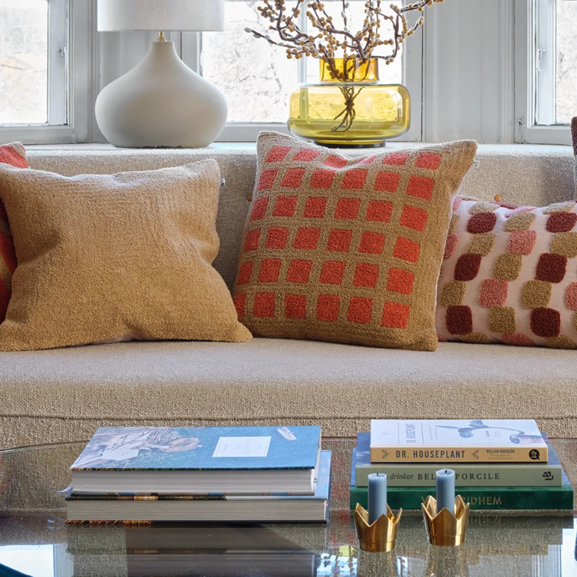 Soft and cozy Mohan Boucle Cushion with a beautiful sand and apricot orange color palette