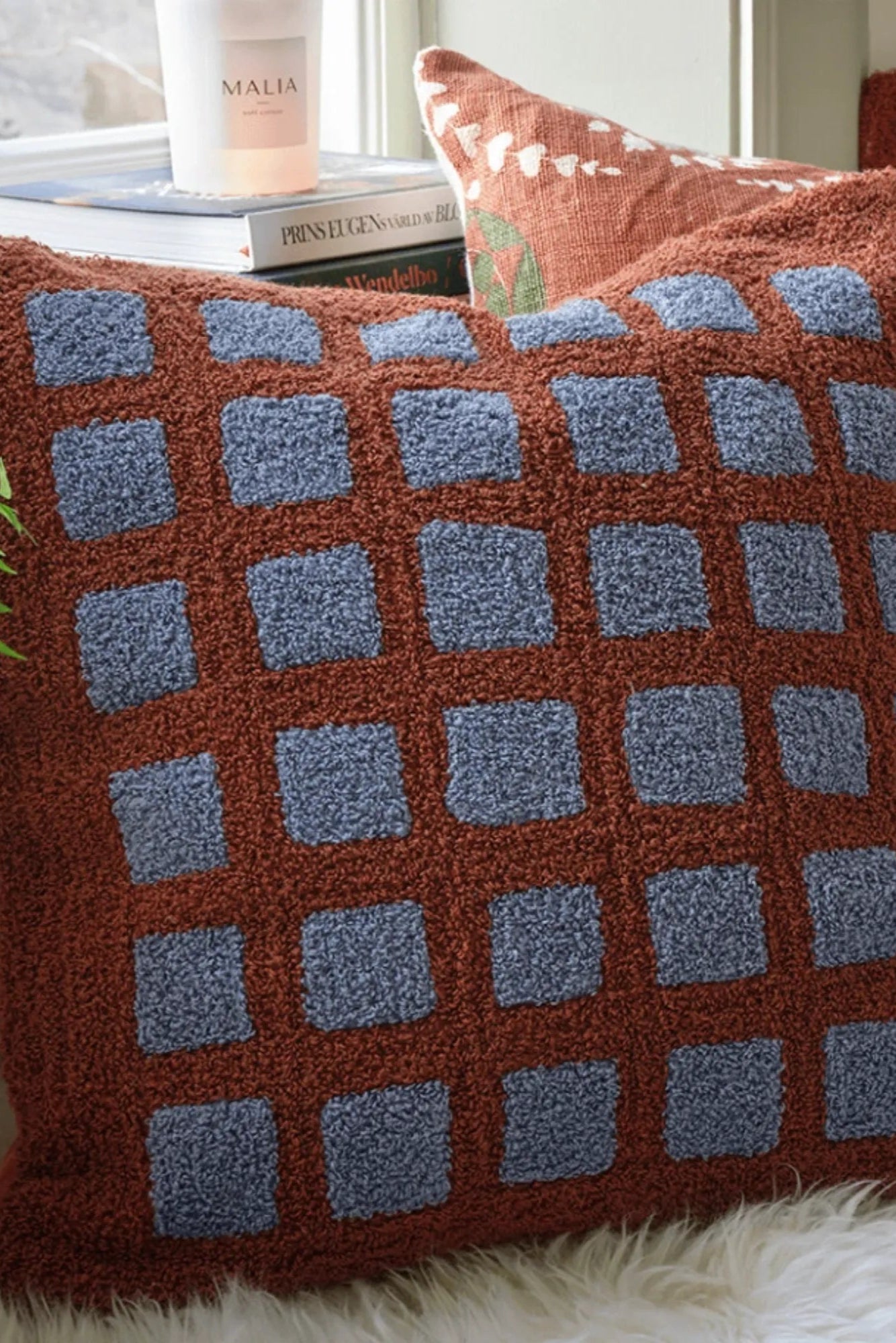 Soft and cozy Mohan Boucle Cushion in Terracotta and Dusty Blue