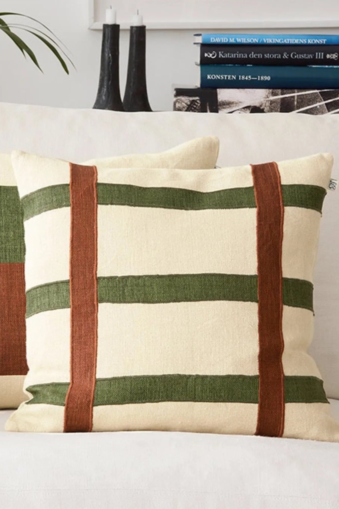 Square throw pillow with linen fabric in earthy tones