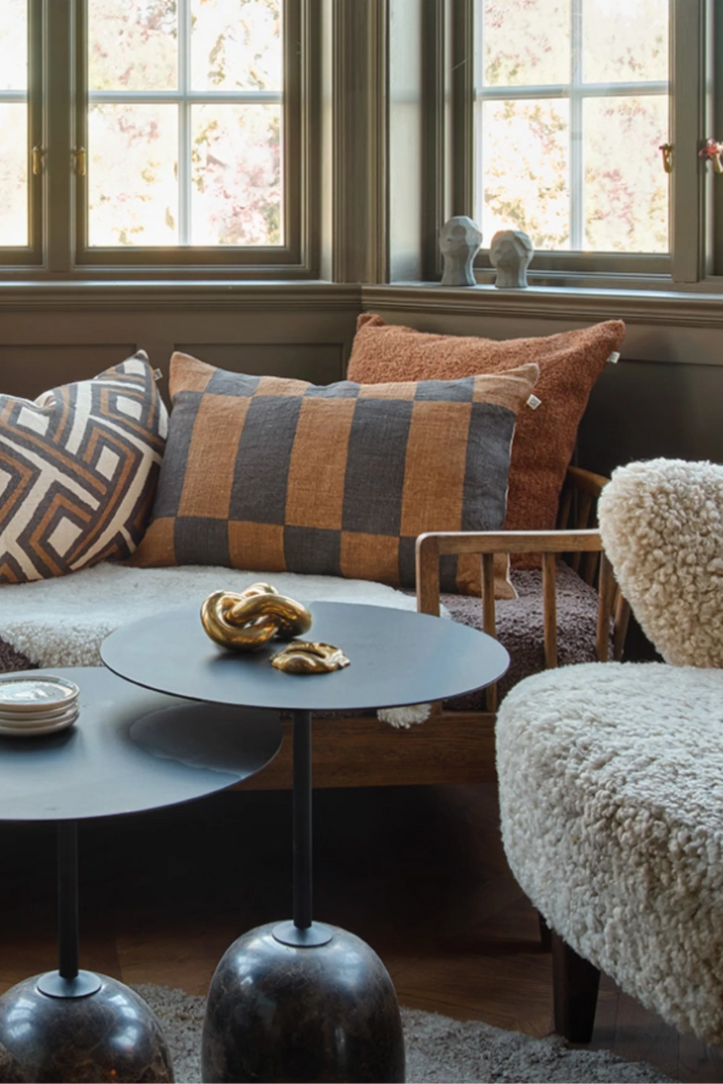 Chhatwal & Jonsson Samar Linen Throw Pillow, a rectangular linen cushion featuring a bold checkerboard pattern in warm caramel brown and dark charcoal grey, with a rustic textured weave. This organic modern throw pillow is perfect for adding cozy style to living room sofas or bedroom accents.