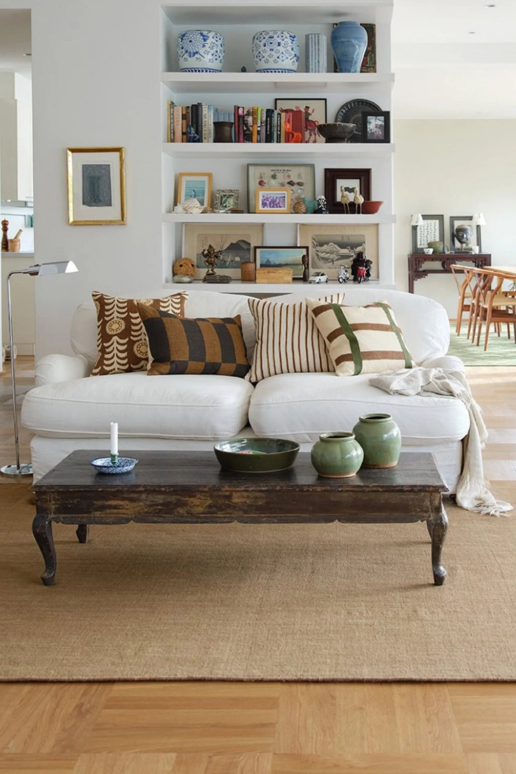 Chhatwal & Jonsson Samar Linen Throw Pillow, a rustic collection of handcrafted woven linen cushions in earthy brown, natural tan, and olive green tones, featuring diverse patterns including a circular motif.