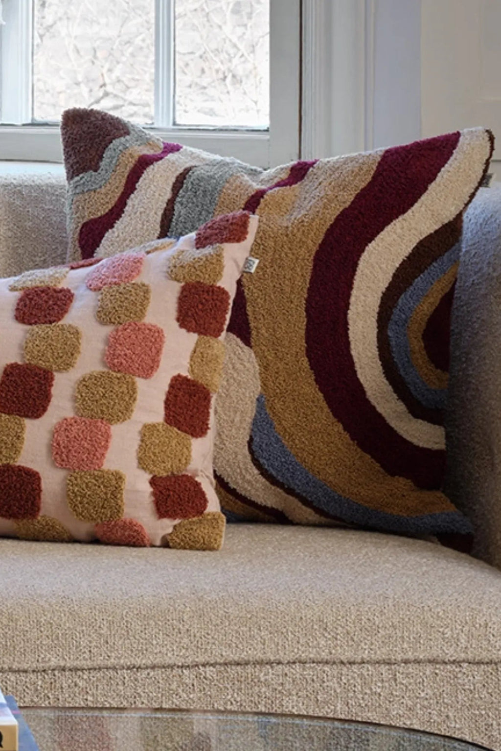 Close-up of Sagar Boucle Cushion Pillow in Dusty Blue and Ruby, showcasing its intricate texture and vibrant colors