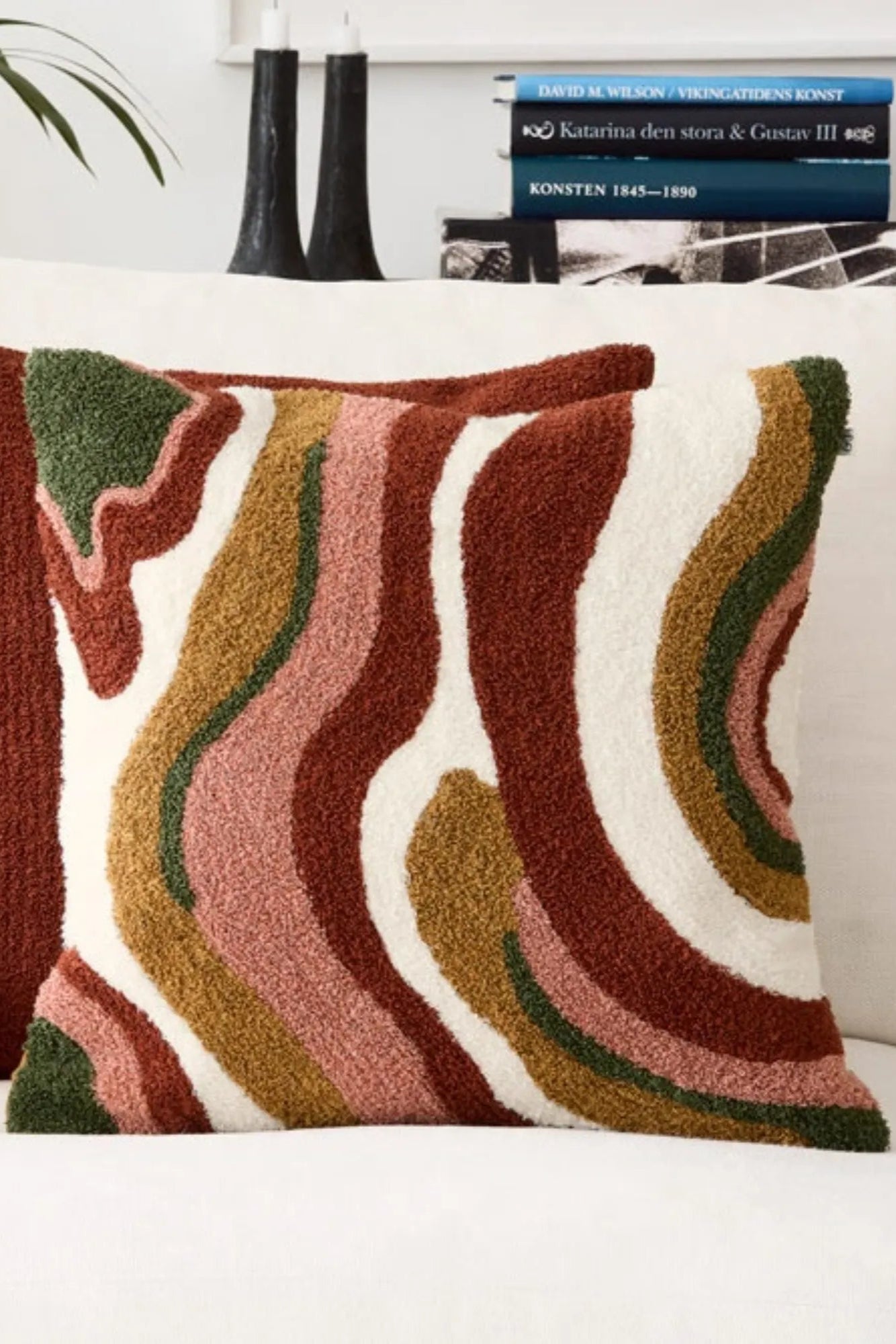Soft and cozy Sagar Boucle Cushion Pillow in a beautiful rust and rose color