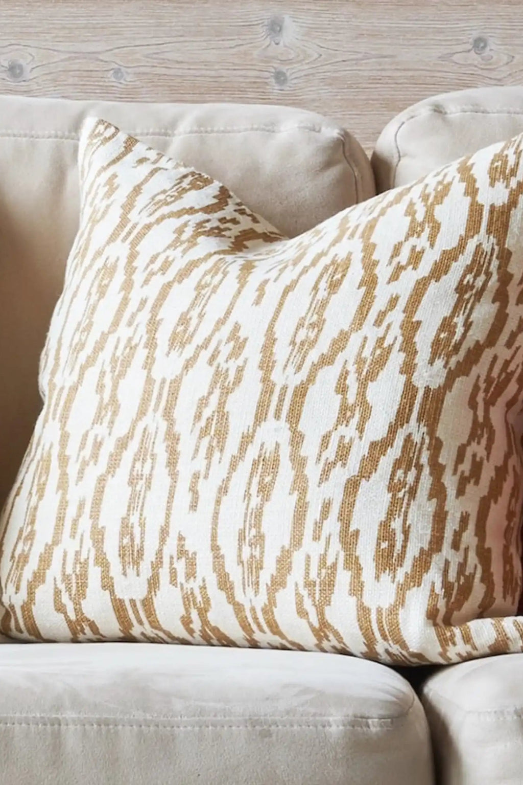 Chhatwal & Jonsson Deccan Linen Throw Pillow, a natural linen decorative cushion featuring an abstract ikat-inspired pattern in warm golden tan and cream tones with a rich textured weave. This inviting throw pillow is perfect for adding organic modern or boho chic style to living room sofas, armchairs, or bedroom accents.
