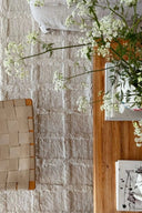 Hand-woven Badal Wool Rug featuring intricate geometric patterns in earthy tones