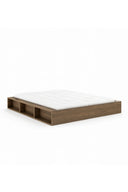 Wooden bed frame with white mattress on a white background