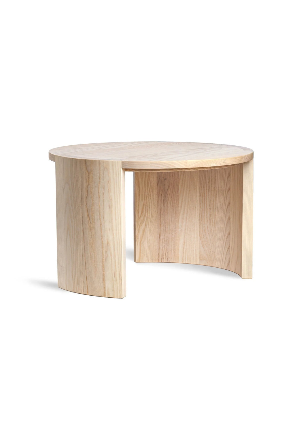 Made by Choice Airisto Coffee Table, a modern round table crafted from light natural wood, featuring a unique curved base design, showcasing its minimalist aesthetic on a clean white background.