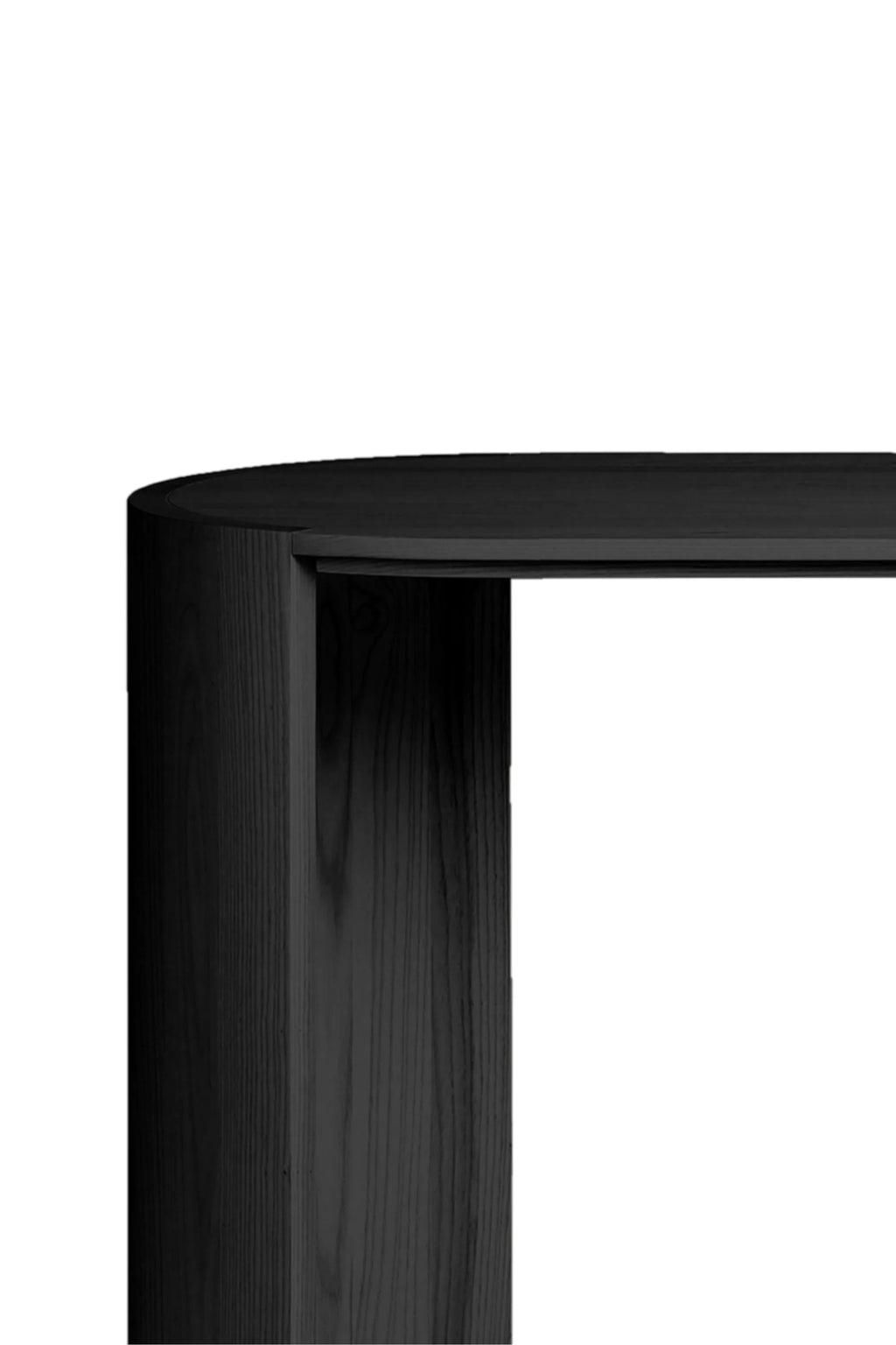 Made by Choice Airisto Desk, a close-up detail of the black wooden desk's curved side panel, highlighting the smooth finish and subtle wood grain texture, against a bright white background.