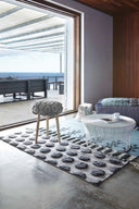 Handmade knitted stool with soft texture and round shape