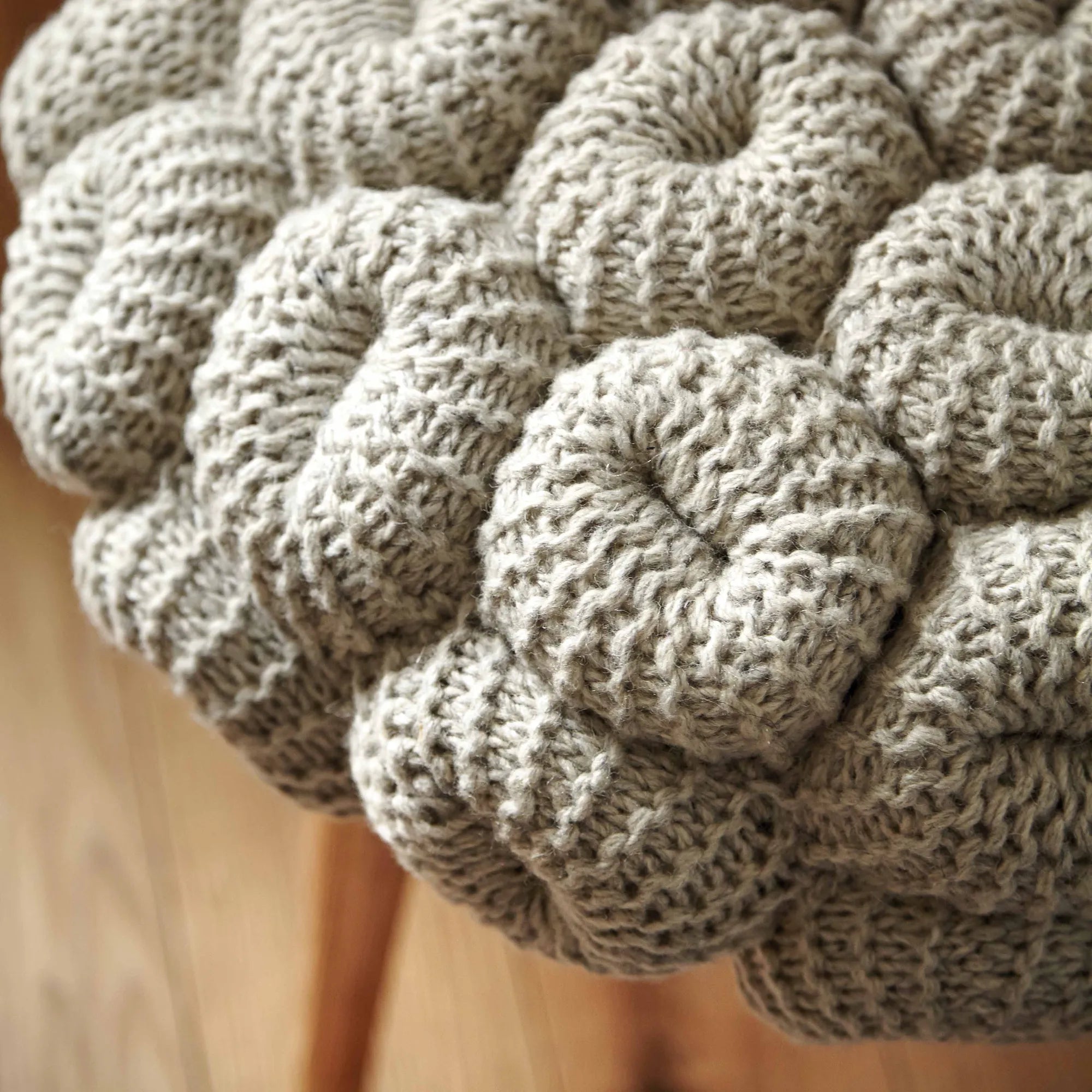 Handcrafted knitted stool made from natural, eco-friendly materials for cozy home decor