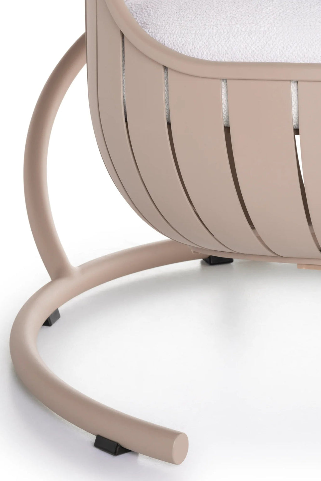 Gandia Blasco Arena Outdoor Swing, featuring a curved nude powder-coated aluminum frame with a distinctive slatted design and a plush white bouclé fabric cushion for ultimate comfort. This modern minimalist outdoor swing provides luxury lounge seating for contemporary patio and garden spaces.