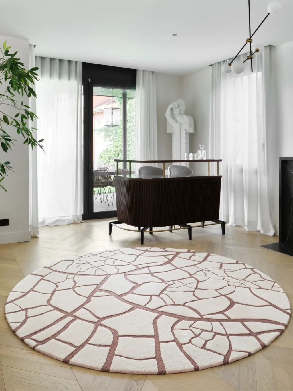 alp_ Aride II Rug, a contemporary round area rug featuring a plush cream wool pile with an abstract, organic cracked earth pattern in a rich terracotta hue. This hand-tufted wool rug offers a soft, inviting texture and a distinctive modern design. Perfect for adding a sophisticated focal point to minimalist living rooms, Scandinavian bedrooms, or contemporary entryways.