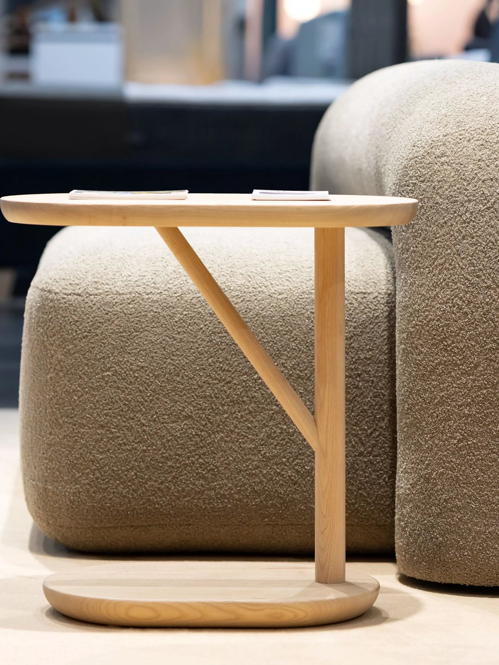 ARTU Moss Lounge Chair, a modern organic lounge chair upholstered in a light beige bouclé fabric with a highly textured, plush finish.