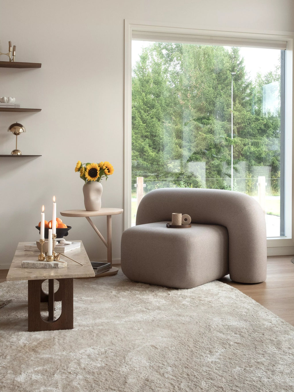 ARTU Moss Lounge Chair, an organic modern lounge chair featuring a distinctive sculptural shape with a continuous, curved profile and plush, armless design. Upholstered in a soft, textured light beige fabric, it offers contemporary comfort. Ideal as a minimalist accent chair for a modern living room or cozy reading nook.