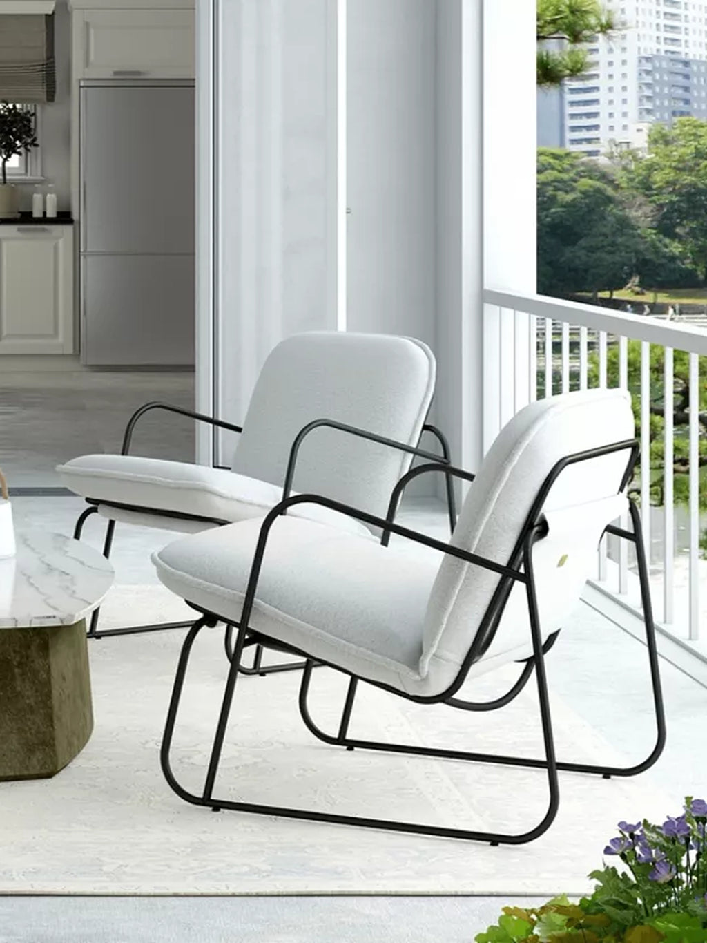 ARTU Tuttu Monteur Armchair, a modern minimalist lounge chair featuring a sleek matte black metal frame with an open, curved silhouette and plush light grey textured fabric upholstery. This contemporary accent chair offers comfortable seating with clean lines, perfect for stylish balcony decor, small living rooms, or as an industrial chic bedroom addition.