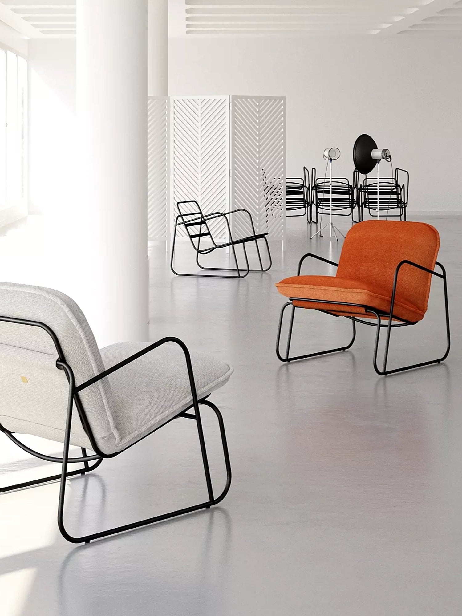 ARTU Tuttu Monteur Armchair, a contemporary lounge chair defined by its sleek, continuous black metal frame and generously padded upholstered cushions. Available in both a soft light grey fabric and a vibrant orange fabric, this modern minimalist armchair offers comfortable deep seating with industrial chic appeal. Perfect as an accent chair for a stylish living room, a cozy bedroom, or a sophisticated waiting area.