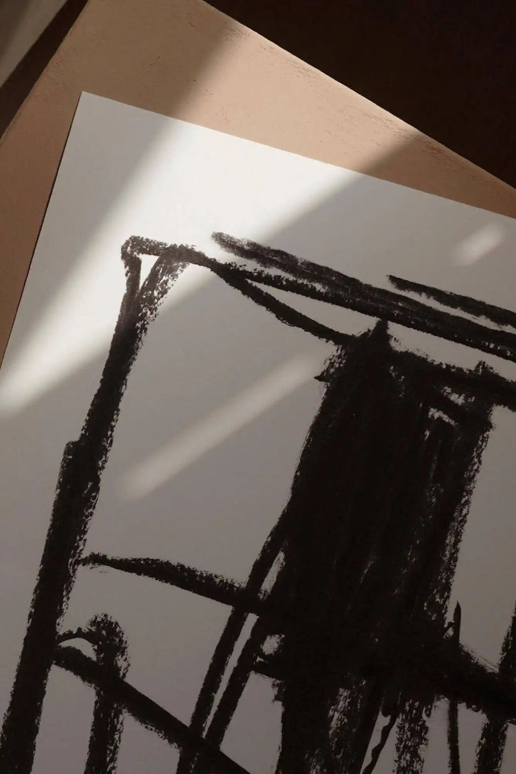 The Poster Club Turmoil, a raw abstract art print featuring bold, textured black charcoal strokes against a clean white background. The expressive, hand-drawn lines create a striking, minimalist geometric composition with a contemporary brutalist aesthetic. This modern abstract poster is perfect for creating a focal point in a contemporary living room, minimalist bedroom, or gallery wall.