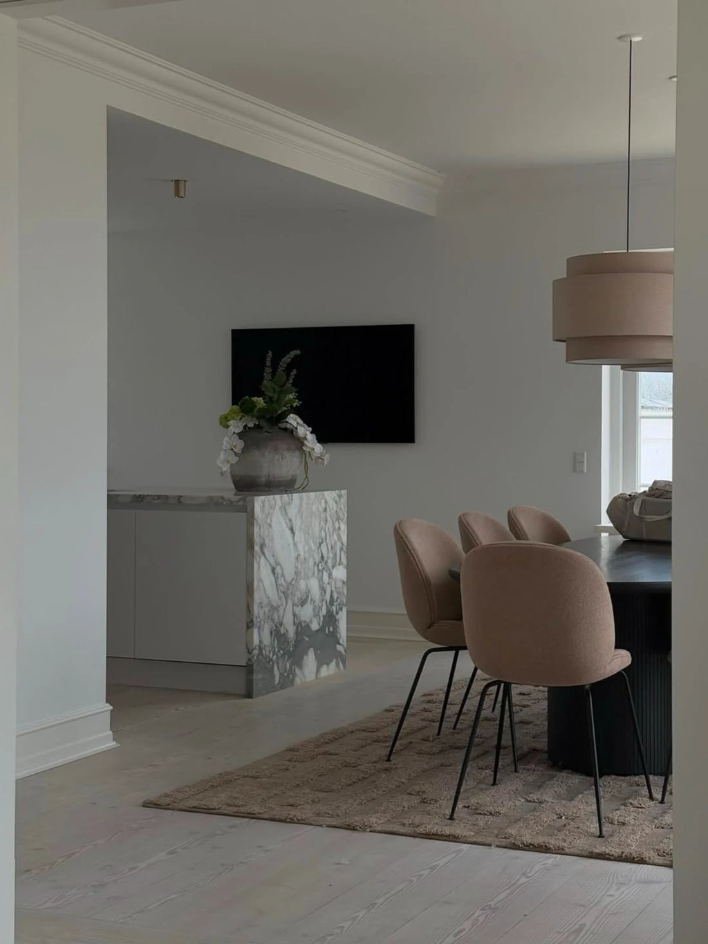Tinted Objects Bielke Wool Rug, a plush, rectangular area rug in a warm taupe or mushroom brown with a textured, subtly striped pattern. This luxurious wool rug adds comfort and style to any contemporary living space, perfect for modern interior design enthusiasts.