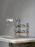 Close-up of BMF Candle Holder on top of a marble designer side table.