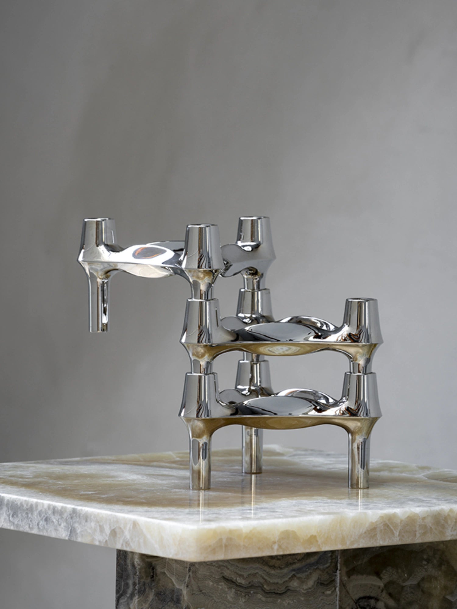 Close-up of BMF Candle Holder on top of a marble designer side table.