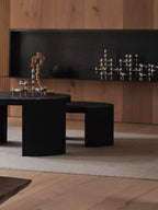 Iconic BMF Candle Holder with sleek geometric design in a modern living room setting.