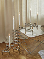 Handcrafted white candles in a set of 8, perfect for home decor and ambiance with the stoff nagel candle holder.
